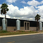 Corrugated Steel Rainwater Tanks with Palm Trees