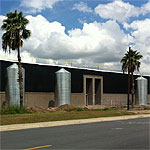 Corrugated Steel Rainwater Tanks with Palm Trees Corrugated Steel Rainwater Tanks with Palm Trees